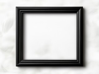 Fototapeta premium A simple black picture frame against a textured white background, ready to showcase art or a photo.
