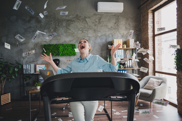 Photo of cheerful impressed lady recruiter dressed shirt catching flying dollars running treadmill...