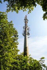 Obraz premium Transmission tower in the countryside. Radio tower in nature. 