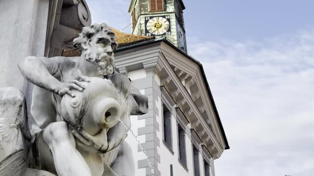 Marble Robba Fountain up close in Mestni Trg with Ljubljana Town Hall in the background