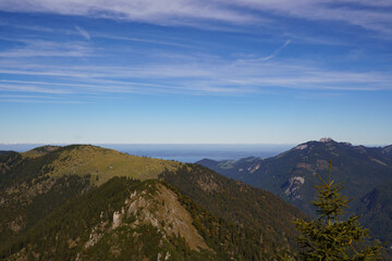 On the summit of the Spitzstein, a popular hiking mountain (Bavarian-Tyrolean border) with a view over the Chiemgau Alps and the Kampenwand to Lake Chiemsee