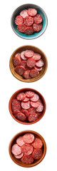 Sliced pepperoni pieces in varied bowls on a white background, perfect for culinary use and food styling.
