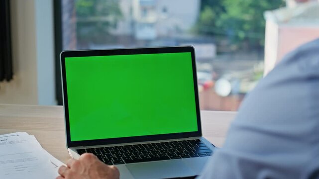 Office manager working mockup laptop at workdesk closeup. Unknown man freelancer