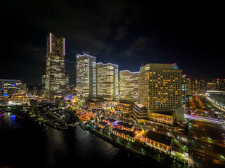 Fototapeta premium A breathtaking view of Yokohama's skyline at night ; Yokohama's cityscape illuminated by countless lights