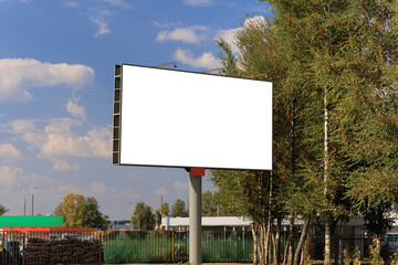 Background for design. Advertising billboard along the road in the city on a sunny day
