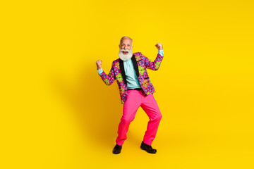 Photo of positive cheerful old man boyfriend raise fists up screaming win isolated yellow color...
