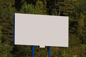 Background for design. Advertising billboard along the road in the city on a sunny day