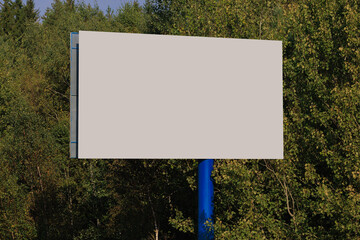 Background for design. Advertising billboard along the road in the city on a sunny day