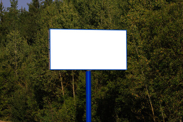 Background for design. Advertising billboard along the road in the city on a sunny day