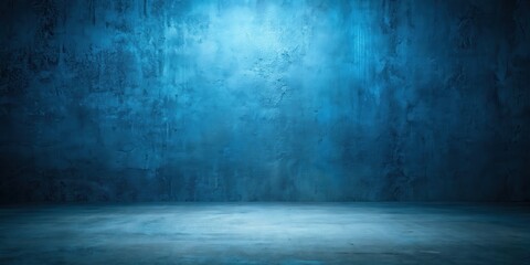 A dimly lit concrete room with a blue wall and a slightly angled floor, perfect for product display or creative design concepts