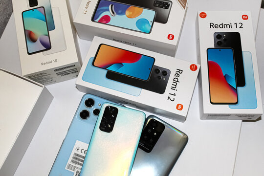 Kyiv, Ukraine. 10.10.2024:Various smartphone models and packaging displayed on a table, showcasing the Redmi and Note series models in detail. Stock editorial photo.