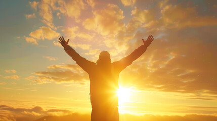 A man is standing in the sun with his arms raised, looking up at the sky