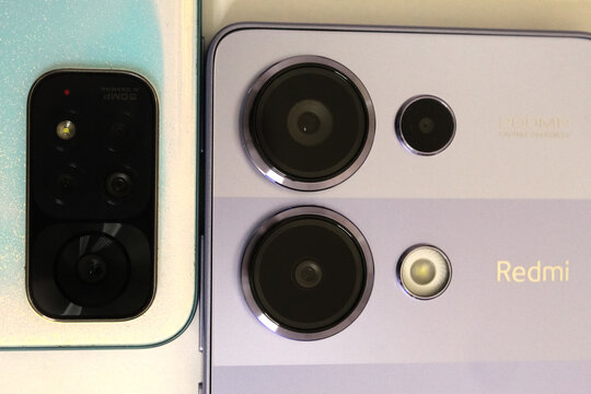 Kyiv, Ukraine. 10.10.2024: Comparison of smartphone Xiaomi redmi note camera designs showcasing dual and triple lens setups on modern devices. Stock editorial photo.