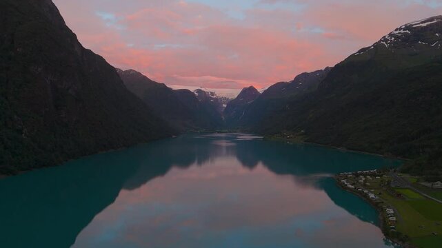 Scenic Oldevatnet lake at Briksdalsbreen glacier by sunset. Norway Scandinavia nature water reflection