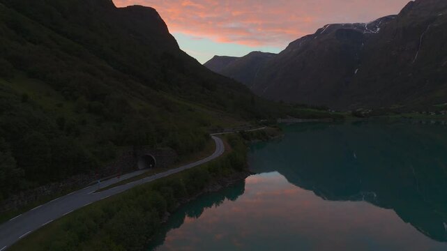 Oldevatnet lake sunset at Briksdalsbreen glacier. Scenic Norway Scandinavia nature water reflection