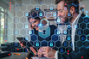 Business professionals collaborating on digital security concepts.