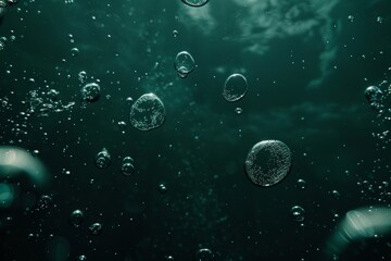 Fototapeta premium Abstract background with bubbles in a green color on dark water, the bubbles floating up suitable for a design, banner, poster, or presentation. Oil, water drops, water ripples, and a light effect