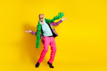Full size photo of eccentric grandfather dance wear colorful blazer pink pants empty space isolated on yellow background