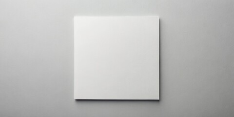 Fototapeta premium A Blank Canvas Awaits Your Creativity An Unblemished Rectangle of Paper on a Subtle Gray Background, Ready to Be Transformed by Your Imagination