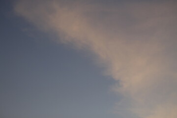 Obraz premium beautiful orange cloudy afternoon bright blue clouds, warm, sunset