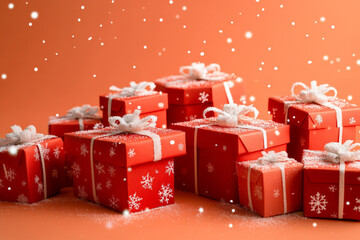 A collection of red gift boxes with white snowflakes stands out against a peach background. The soft, warm tones create a cheerful, festive look perfect for the holiday season.