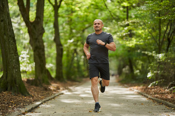 Athletic man running in park