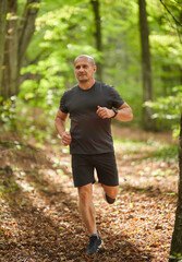 Athletic man running in park