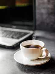 Relax during business work concept, americano coffee cup and black coffee cup aromatic and laptop computer in morning
