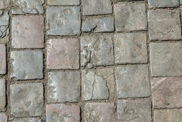 Pavement with square stone blocks