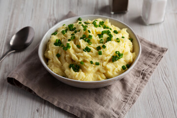 Homemade Chive and Garlic Mashed Potatoes in a Bowl, side view.