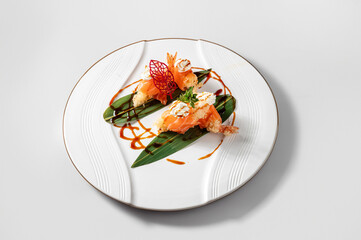 Plate of tempura shrimp with cheese and teryaki sauce, isolated on white background .