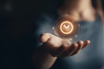 A hand holding a glowing orb with a symbol, suggesting technology or magic.