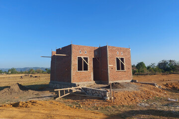 The process of building a permanent house uses red brick
