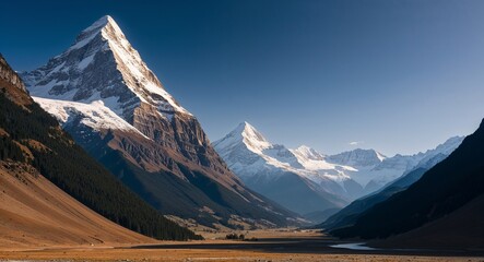 Fototapeta premium Towering mountains with snow capped peaks piercing the sky and a serene valley below