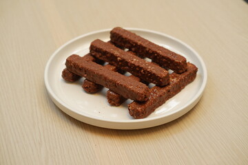Chocolate wafers on a white plate, close-up