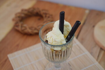 Glass filled with ice cream and wafer