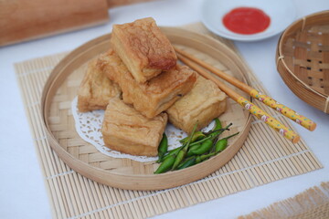 Tahu Bakso, Indonesian traditional snack made from tofu and beef. Served in wooden plate.
