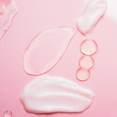 Cosmetic samples texture. Smears of transparent liquid cosmetics on a pink background