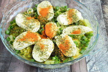 Prepare making broccoli casserole with mozzarella, spring onion and paprika powder