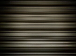 Old dark metal roller shutters door. Line pattern texture aluminum doors background. Old dark metal background texture.