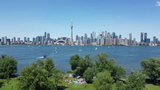 Downtown Toronto skyline waterfront view from the 
Centre Island showing the entire city shoreline including the famous CN tower.
