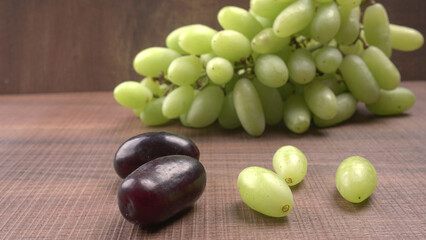 Natural organic different types of fresh ripe juicy grapes and space for text on table. top view, Agriculture concepts.