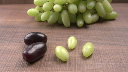 Natural organic different types of fresh ripe juicy grapes and space for text on table. top view, Agriculture concepts.