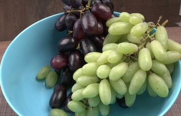 Natural organic different types of fresh ripe juicy grapes and space for text on table. top view, Agriculture concepts.
