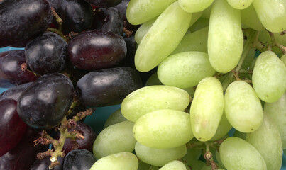 Natural organic different types of fresh ripe juicy grapes and space for text on table. top view, Agriculture concepts.