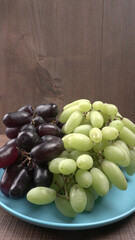 Natural organic different types of fresh ripe juicy grapes and space for text on table. top view, Agriculture concepts.