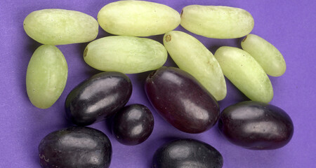 Natural organic different types of fresh ripe juicy grapes and space for text on table. top view, Agriculture concepts.