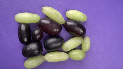 Natural organic different types of fresh ripe juicy grapes and space for text on table. top view, Agriculture concepts.