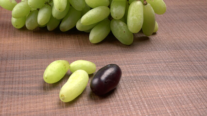 Natural organic different types of fresh ripe juicy grapes and space for text on table. top view, Agriculture concepts.