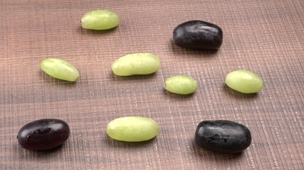 Natural organic different types of fresh ripe juicy grapes and space for text on table. top view, Agriculture concepts.